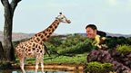 Steve Backshall and a giraffe from Deadly Planet game